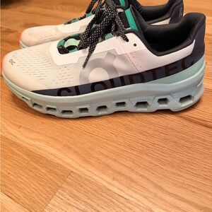 On Running Cloudtec Shoes in White and Black with Mint Accents